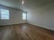 Bright bedroom with two windows allowing plenty of natural light at 2137 Sunshine Peak Dr, Minneola, FL 34715