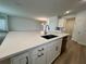This kitchen includes a large center island with sink and modern hardware at 2137 Sunshine Peak Dr, Minneola, FL 34715