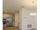 Kitchen features stainless steel appliances and light cabinets at 2137 Sunshine Peak Dr, Minneola, FL 34715