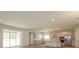 Open concept kitchen with island and stainless steel appliances at 2137 Sunshine Peak Dr, Minneola, FL 34715