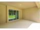 Covered patio with sliding glass doors and view of backyard at 2137 Sunshine Peak Dr, Minneola, FL 34715