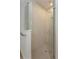 Large walk-in shower with glass enclosure and neutral tile at 2137 Sunshine Peak Dr, Minneola, FL 34715