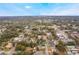 Wide aerial view showing property's location in the neighborhood at 221 S Johns St, Mount Dora, FL 32757