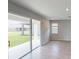 Gathering room with sliding glass doors leading to the backyard at 2232 Juniper Berry Dr, Minneola, FL 34715
