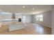Open kitchen with island, granite countertops and stainless steel appliances at 2232 Juniper Berry Dr, Minneola, FL 34715
