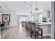Open kitchen with island, stainless steel appliances, and hardwood floors at 2252 Juniper Berry Dr, Minneola, FL 34715