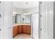 Double vanity bathroom with granite countertops and a separate shower at 233 Monterey St, Kissimmee, FL 34759