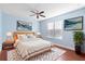 Relaxing bedroom with light walls, wood bed frame, and plenty of natural light at 233 Monterey St, Kissimmee, FL 34759