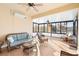 Relaxing sunroom with wicker furniture and lake view at 233 Monterey St, Kissimmee, FL 34759