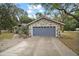 Exterior view of the house's attached garage at 25900 Oakridge Ave, Sorrento, FL 32776