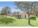 House exterior view, showcasing a large backyard at 2717 Breezy Meadow Rd, Apopka, FL 32712