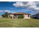 Single story home with brown roof and screened porch at 27507 Pine Straw Rd, Leesburg, FL 34748