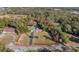 Expansive property featuring a pool and surrounded by lush trees, enclosed by a defined perimeter at 2937 Eagles Nest Rd, Fruitland Park, FL 34731