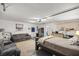 Finished basement with sofa, bed and storage at 2937 Eagles Nest Rd, Fruitland Park, FL 34731
