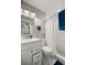Stylish bathroom featuring a modern vanity, toilet, and shower with tile surround at 2937 Eagles Nest Rd, Fruitland Park, FL 34731