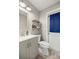Practical bathroom with a vanity sink, toilet, and a door to the outside at 2937 Eagles Nest Rd, Fruitland Park, FL 34731
