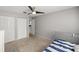 Cozy bedroom with a ceiling fan, closet, and neutral walls and carpet at 2937 Eagles Nest Rd, Fruitland Park, FL 34731