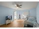 Tranquil bedroom features light blue walls and a bright ambiance from the natural light at 2937 Eagles Nest Rd, Fruitland Park, FL 34731