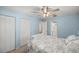 Comfortable bedroom features a ceiling fan, neutral walls, and built-in closet at 2937 Eagles Nest Rd, Fruitland Park, FL 34731