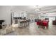 Open layout of the kitchen and dining area, seamlessly combining culinary and dining experiences at 2937 Eagles Nest Rd, Fruitland Park, FL 34731