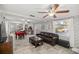 Open living room with view of dining area and kitchen at 2937 Eagles Nest Rd, Fruitland Park, FL 34731