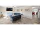 Relaxing living room with comfortable seating and a large TV at 2937 Eagles Nest Rd, Fruitland Park, FL 34731
