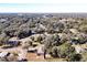 Aerial view of a house and surrounding neighborhood, showcasing its location and landscape at 305 W Lady Lake Blvd, Lady Lake, FL 32159