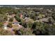 Aerial view of a residential neighborhood, highlighting a house's location and landscape at 305 W Lady Lake Blvd, Lady Lake, FL 32159