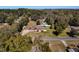 Aerial view of a single Gathering home with a large yard and pool at 305 W Lady Lake Blvd, Lady Lake, FL 32159