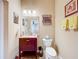 Clean bathroom with dark wood vanity and granite countertop at 305 W Lady Lake Blvd, Lady Lake, FL 32159