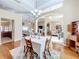 Elegant dining room features hardwood floors and a lovely table setting at 305 W Lady Lake Blvd, Lady Lake, FL 32159