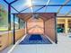 Covered gazebo with ceiling fan and blue rug at 305 W Lady Lake Blvd, Lady Lake, FL 32159