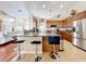 Updated kitchen featuring granite countertops and stainless steel appliances at 305 W Lady Lake Blvd, Lady Lake, FL 32159