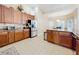Bright kitchen with stainless steel appliances and ample cabinet space at 305 W Lady Lake Blvd, Lady Lake, FL 32159