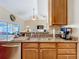 Kitchen with granite countertops, double sink, and stainless steel appliances at 305 W Lady Lake Blvd, Lady Lake, FL 32159
