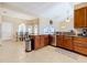 Kitchen features granite countertops, stainless steel appliances, and breakfast nook at 305 W Lady Lake Blvd, Lady Lake, FL 32159