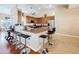 Modern kitchen with granite countertops and breakfast bar seating at 305 W Lady Lake Blvd, Lady Lake, FL 32159