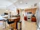 Spacious kitchen with granite countertops, stainless steel appliances, and an island at 305 W Lady Lake Blvd, Lady Lake, FL 32159
