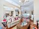 Open and airy living room with hardwood floors and ample natural light at 305 W Lady Lake Blvd, Lady Lake, FL 32159