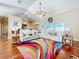 Relaxing living room with vaulted ceilings, hardwood floors, and a sectional sofa at 305 W Lady Lake Blvd, Lady Lake, FL 32159