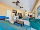 Spacious covered patio with pool, table and chairs, and ceiling fans at 305 W Lady Lake Blvd, Lady Lake, FL 32159