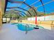 Enjoy this refreshing pool with a screened enclosure at 305 W Lady Lake Blvd, Lady Lake, FL 32159