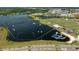 Aerial view of the lake with the wakeboarding park and restaurants at 3150 Voyager Ave, St Cloud, FL 34771