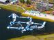 Expansive aqua park featuring water slides, inflatables, and beach with playground and picnic tables at 3150 Voyager Ave, St Cloud, FL 34771