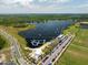 Aerial view of lake with sports park, water park, and restaurants at 3150 Voyager Ave, St Cloud, FL 34771