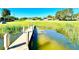 Wooden dock extending over calm water at 3155 Lakeshore Dr, Mount Dora, FL 32757