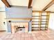 Fireplace with built-in shelving at 3155 Lakeshore Dr, Mount Dora, FL 32757