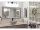 Updated bathroom featuring a vessel sink and a large mirror at 3259 Markward Dr, The Villages, FL 32163
