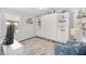 Guest bedroom with Murphy bed, built-in shelving and seating at 3259 Markward Dr, The Villages, FL 32163
