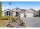 Two-story house with a large driveway and landscaped yard at 3259 Markward Dr, The Villages, FL 32163
